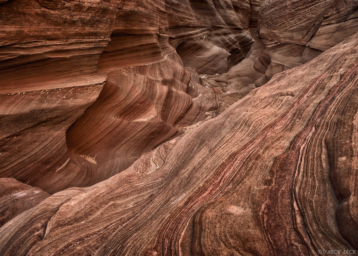 Dried streambed and eroded sandstone walls of the slot canyon - Waterholes Canyon, Arizona