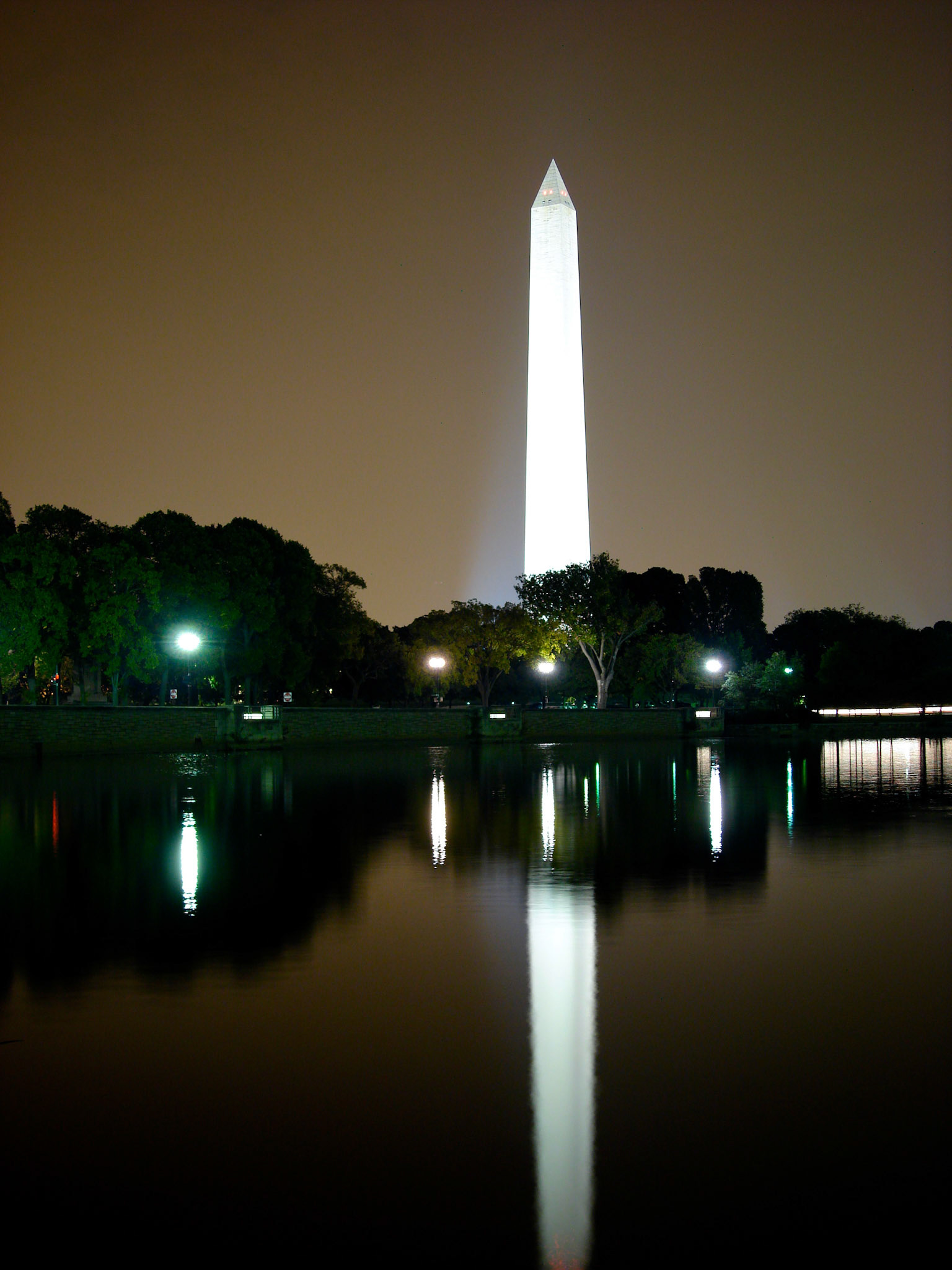 The Washington Monument reflecting upon the bay.