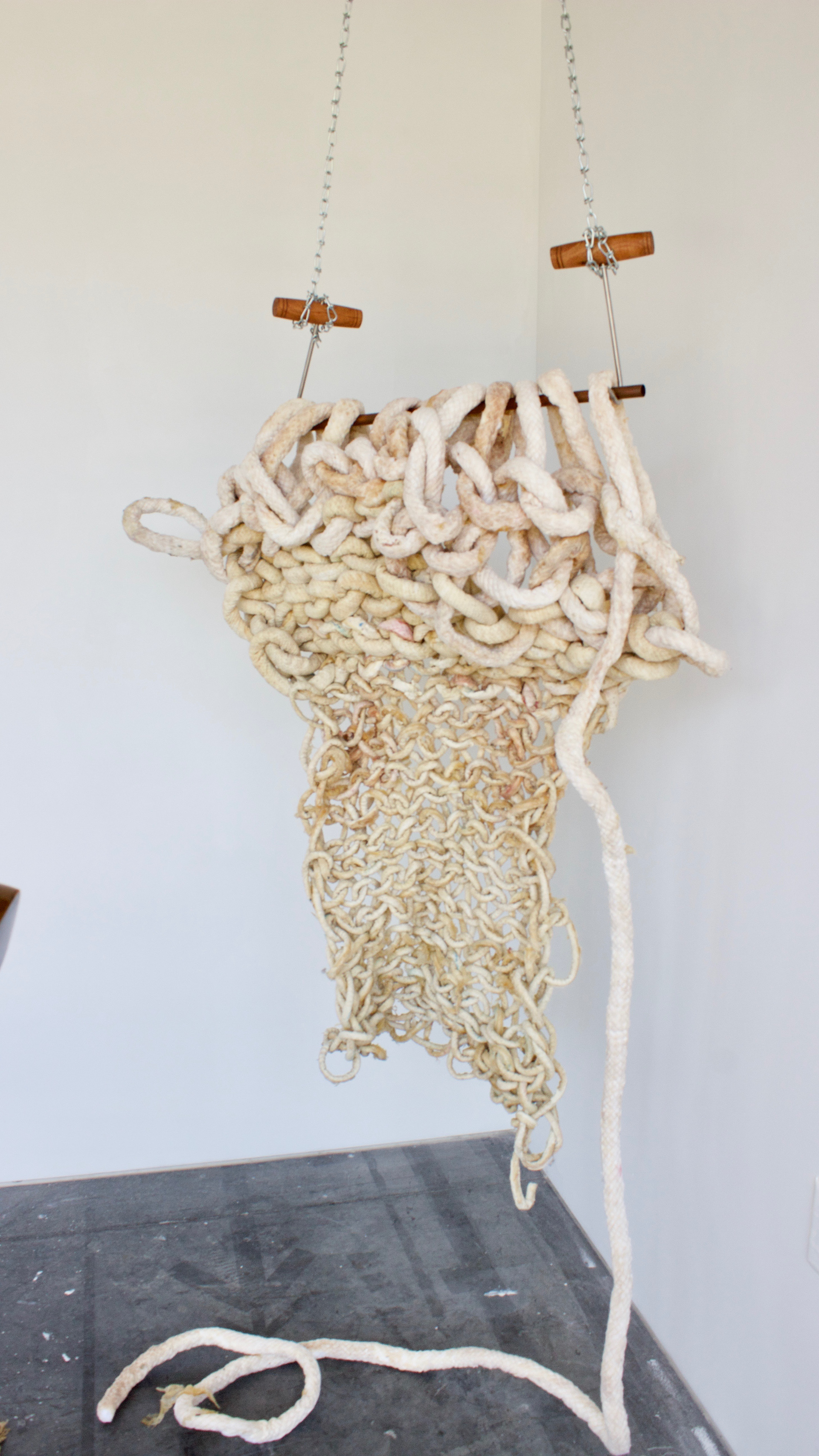 sculptural remnants from an hour and forty minute long performance. Arm knitting latex cord