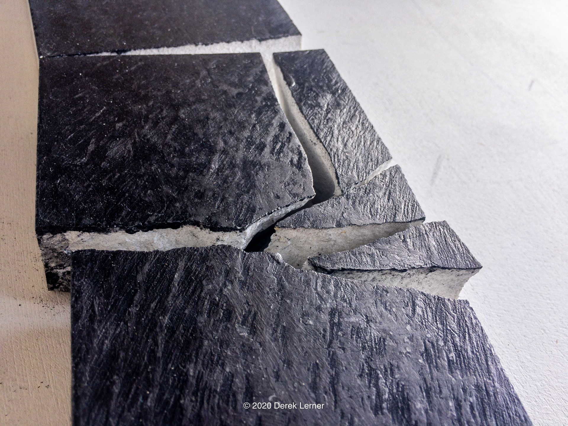 Detail of Fracture 14s, Derek Lerner 2020 Graphite, engineered marble, and varnish 3.5" x 17" x 1" (8.89cm x 43.18cm x 2.54cm)