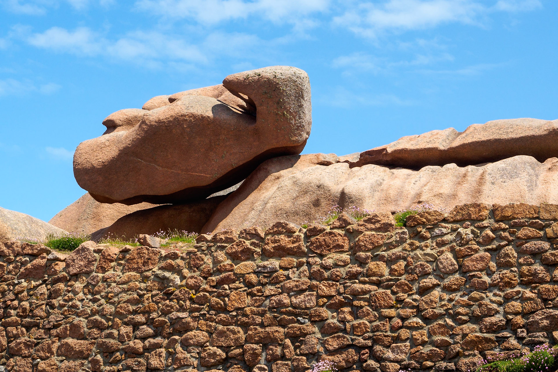Sometimes the boulders on the pink granite coast of Brittany are in scary poses. This one is found at the site of the Mean Ruz lighthouse in Ploumanach