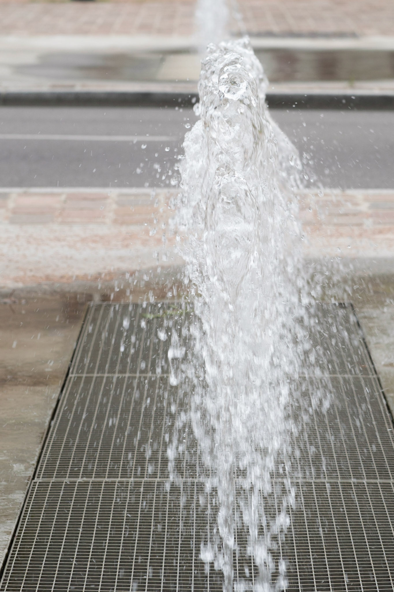 A fleeting appearance of a human-like figure in this fountain in Honfleur, Normandy.