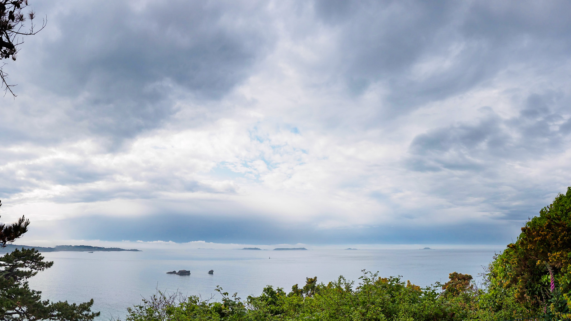 View on 5 of the famous 7 islands under a clouded sky, from the higher part of Perros-Guirec, Bretagne, France