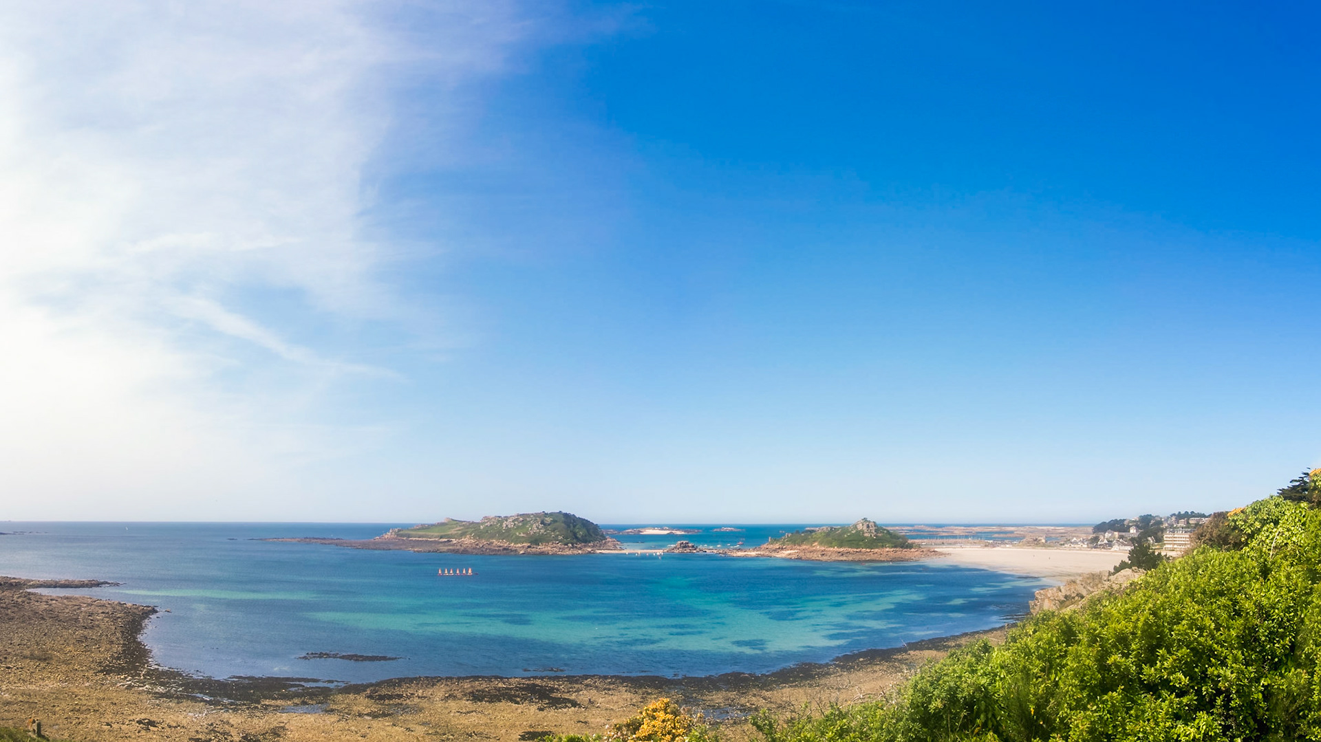 The bay of Trébeurden seen from Pointe de Bihit. Wonderful blue ocean, a line of small sailing boats, vacation!