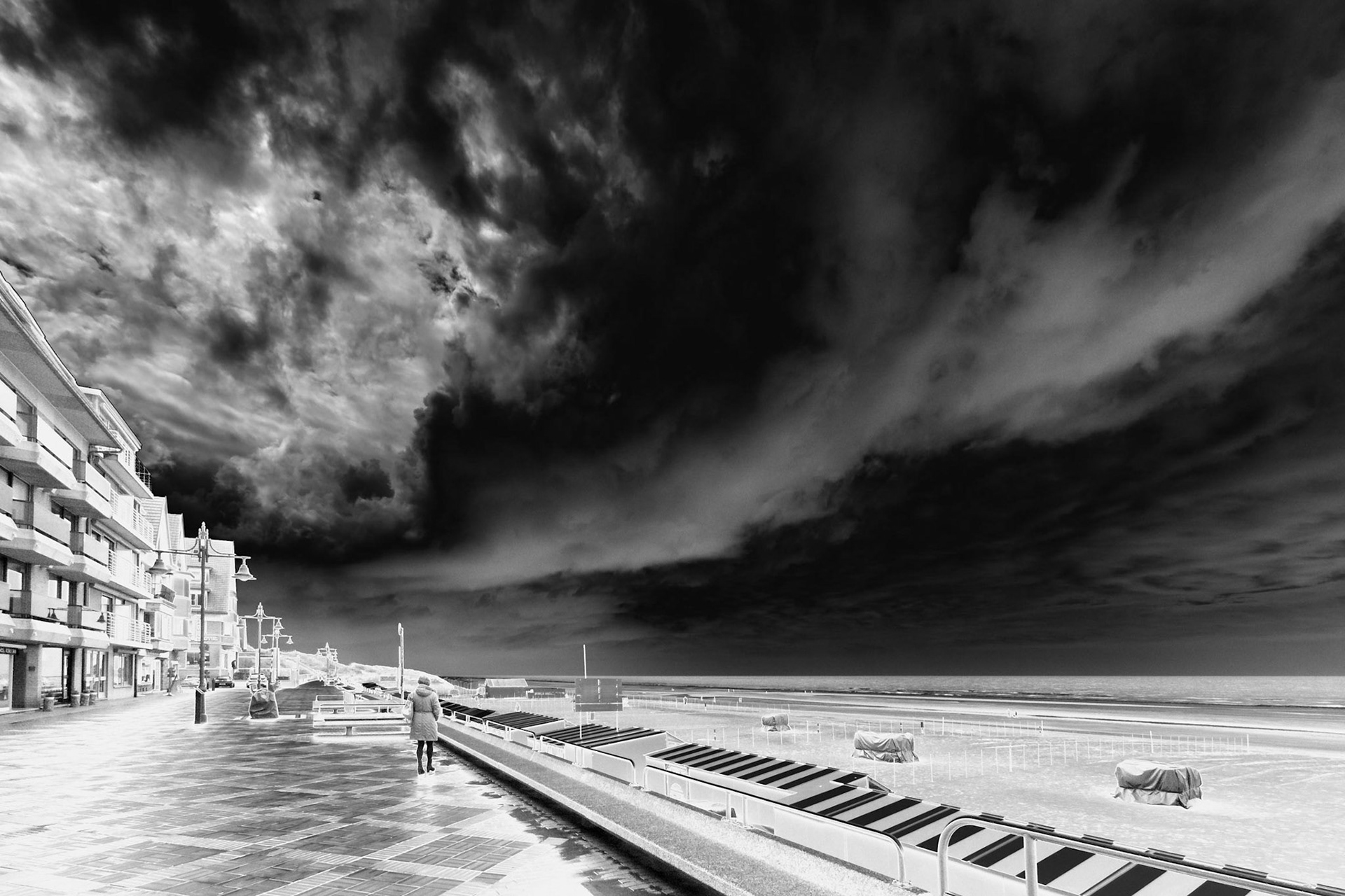 Impressive dark and moody cloudscape over an otherwise peaceful scene.