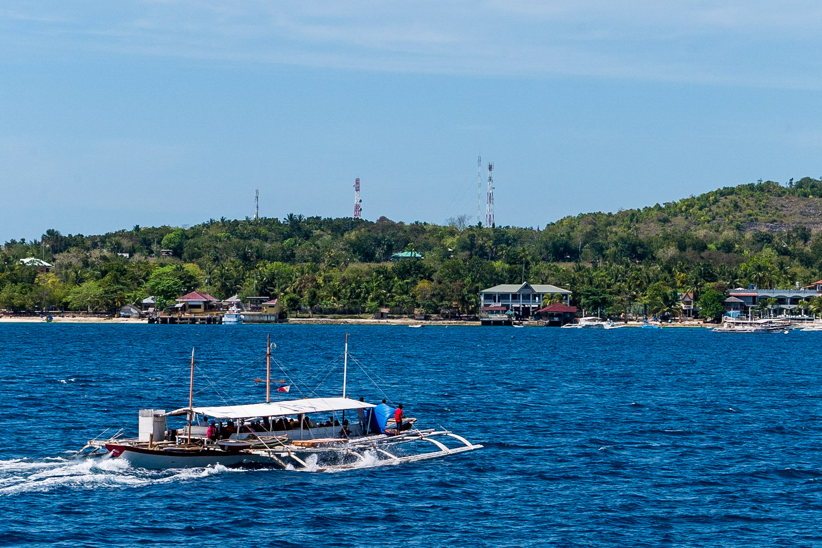 The Philippines, banca ferry boat approaching Cebu Island