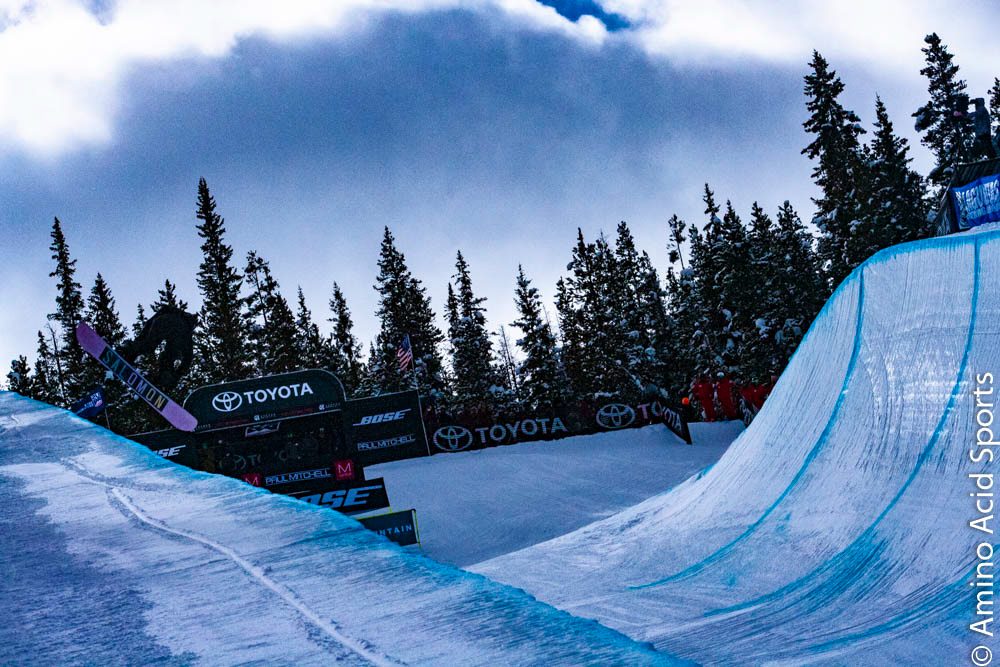 USA's Maddie Mastro takes her Run 1 north of the border with a 540* canadian bacon grab tween the legs.