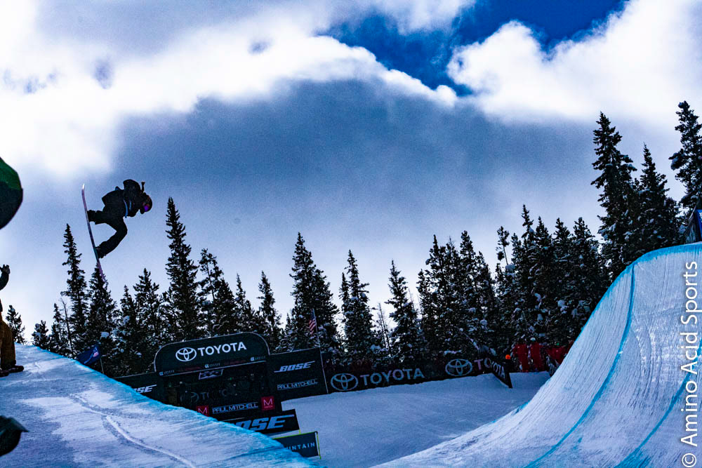 USA's Maddie Mastro takes her Run 1 north of the border with a 540* canadian bacon grab tween the legs.