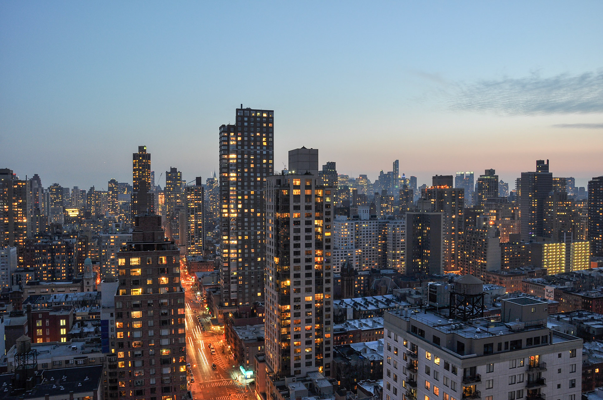 Yorkville, New York City, NY // Manhattan skyline from a roof on the Upper East Side.  First Avenue is below and a sunset in the background.  // 3/10/2014
