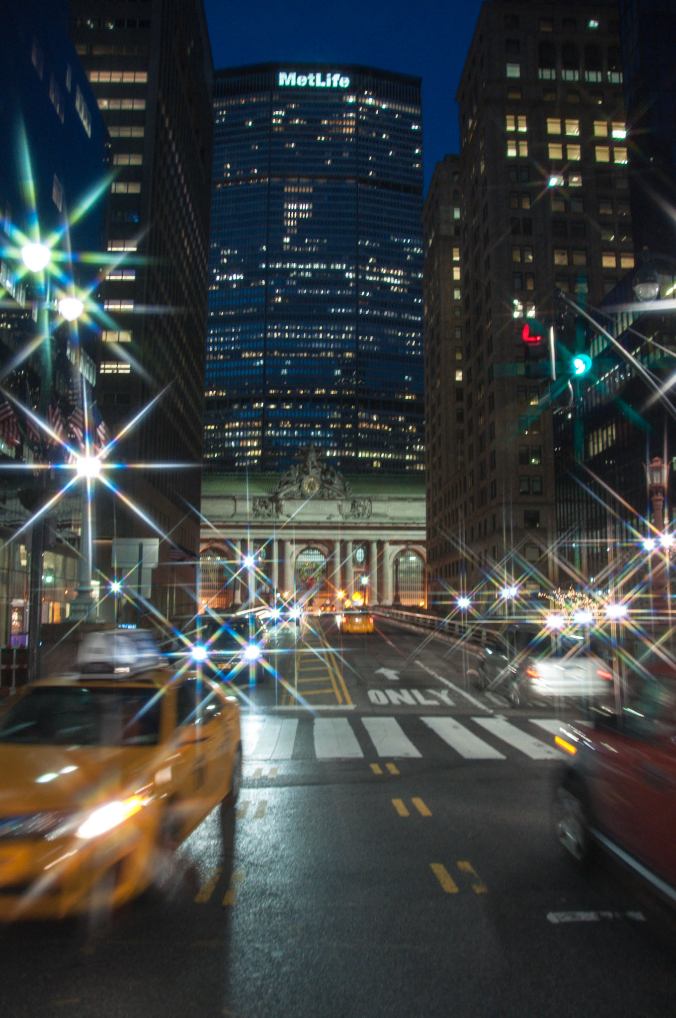 Park Avenue, approaching Grand Central Terminal. The MetLife Building towers over the scene.