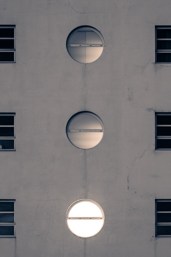 Architectural photography, close up view of a modern building with circular windows
