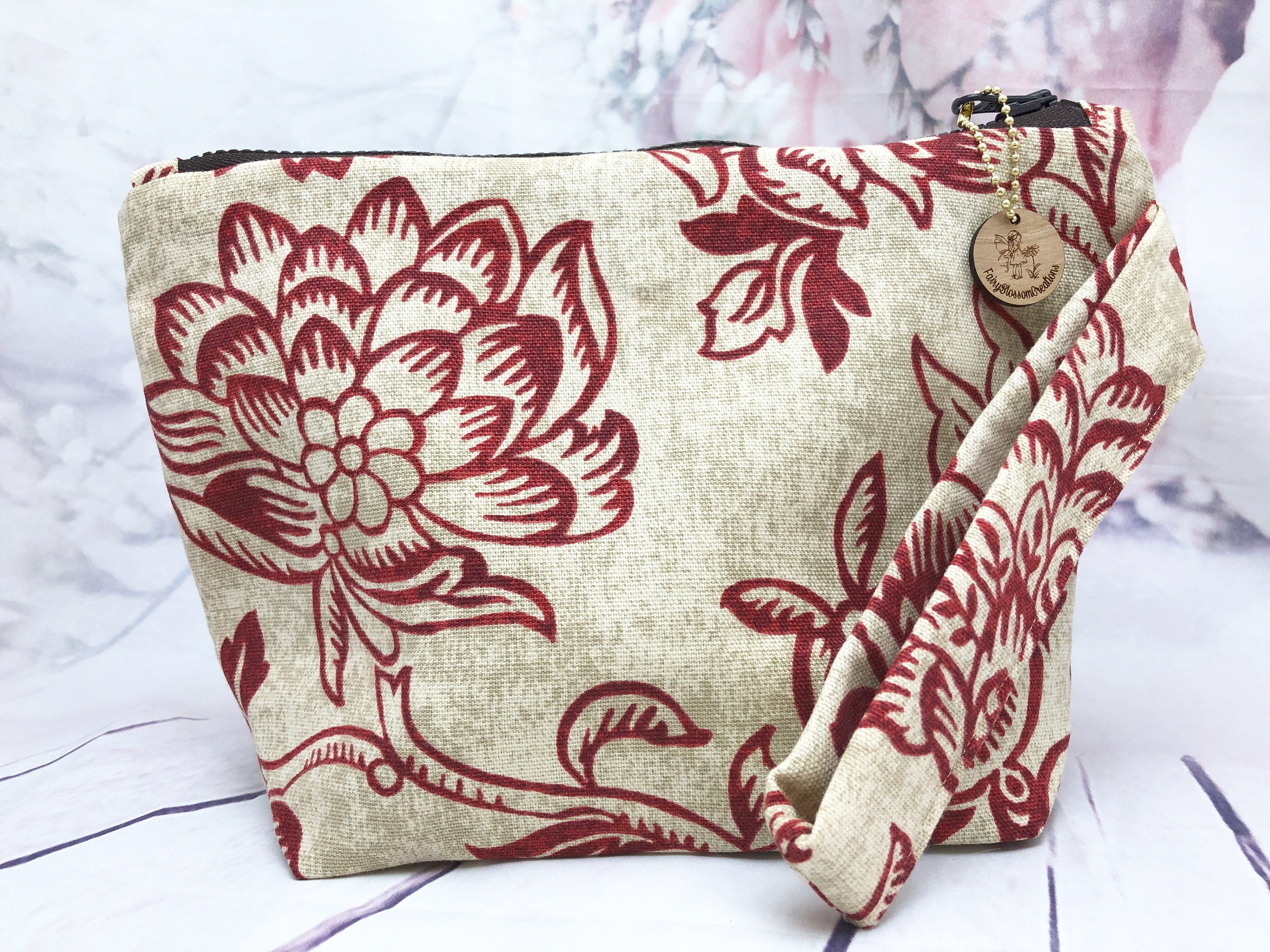 Makeup bag with wristlet strap