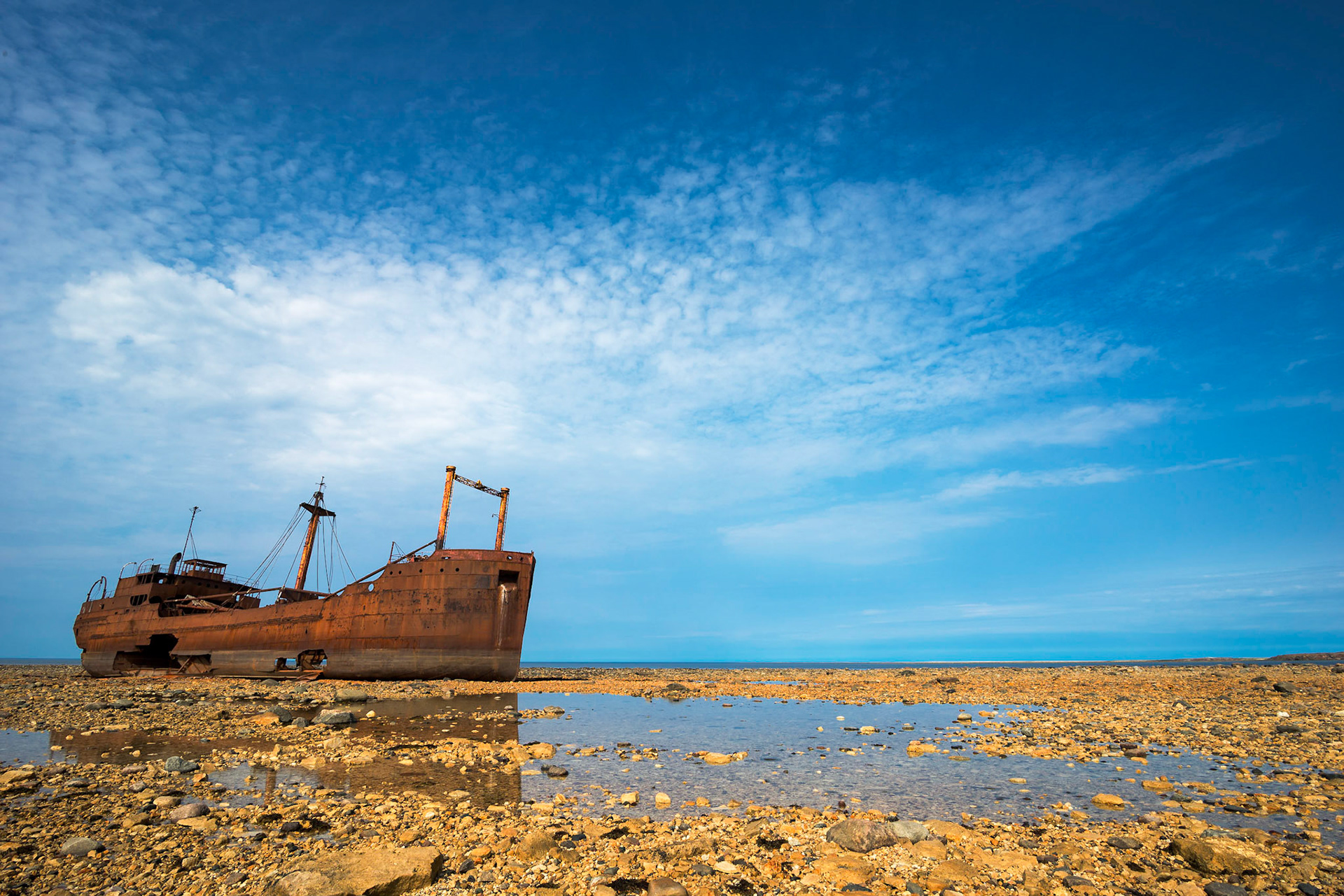The Ithaca shipwreck on the gravel bank of the Hudson Bay, near Churchill, Manitoba, Canada.You can only walk to the wreck on low tide and under the protection of a guide with a gun - it is  polar bear country! We encountered a mother and a cub on our way.