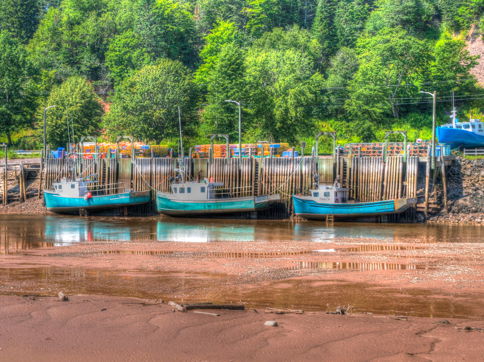 Boats at low tide in the harbour at St Martins